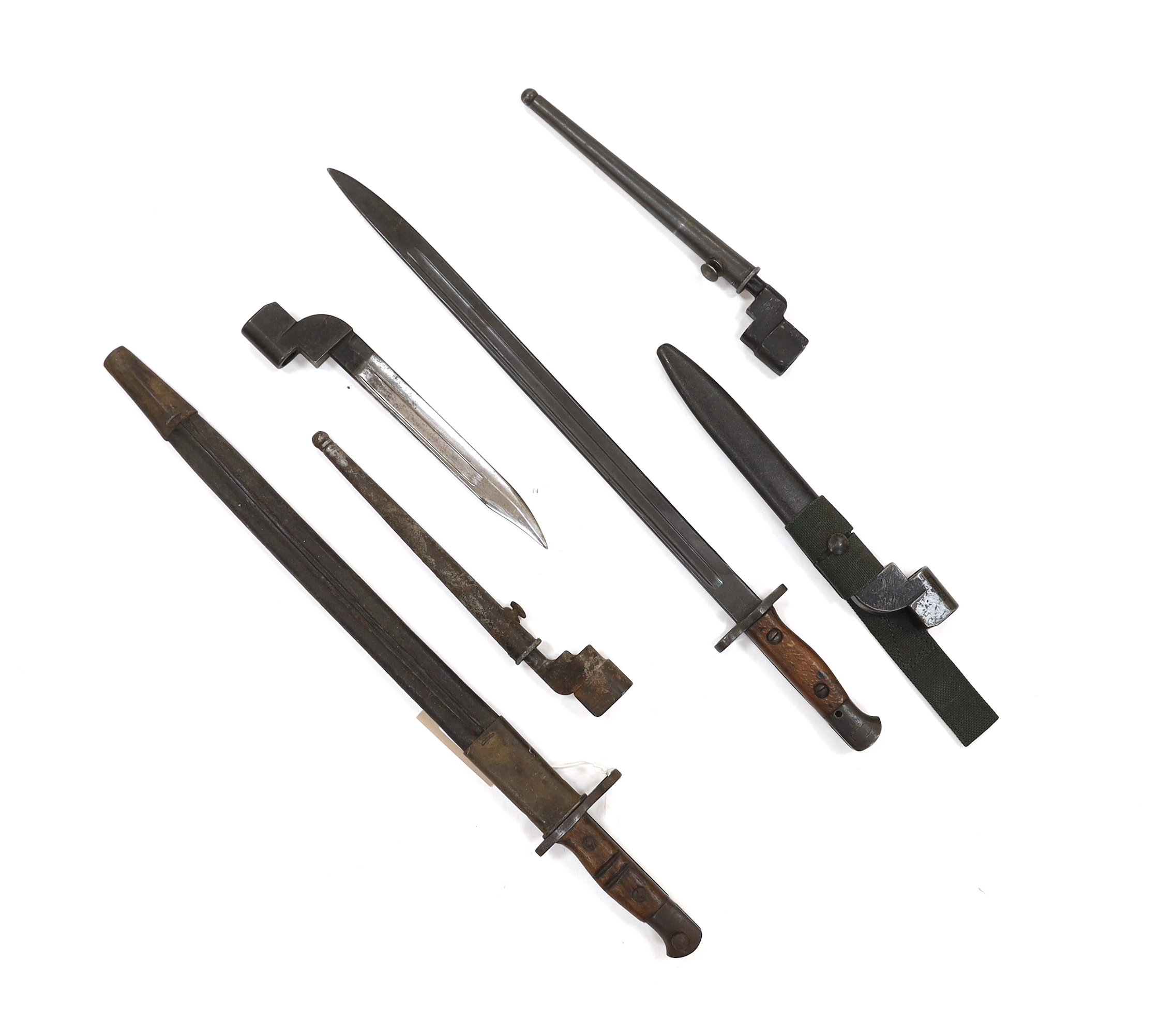 Six bayonets; an American Remington bayonet dated 1917 in its leather scabbard, a British 1907 bayonet with scabbard missing, and four assorted spike bayonets